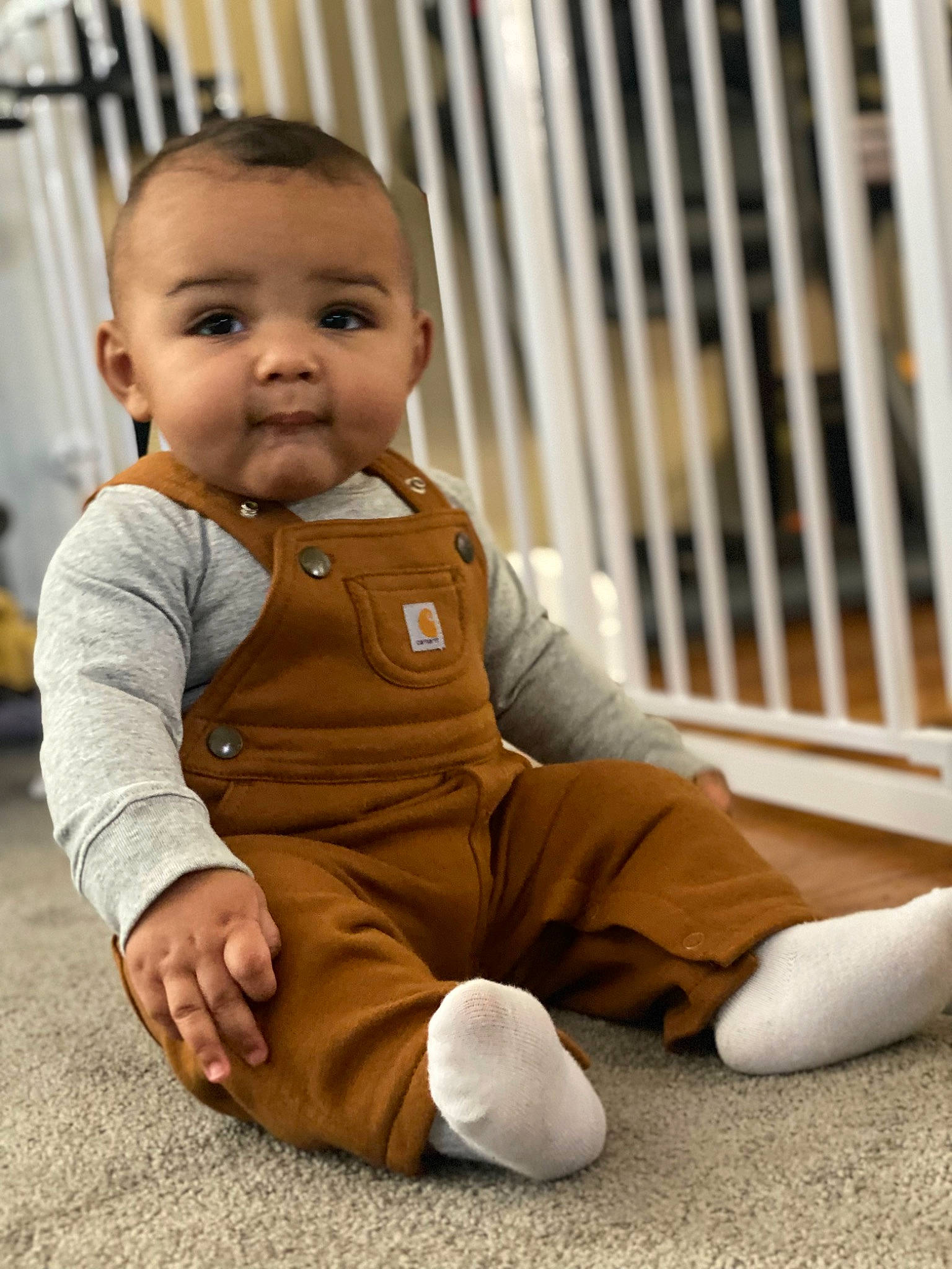 Kalvin joined the competition — help win amazing prizes! baby, baby_toddler_clothing, cheek, child, comfort, crawling, floor, flooring, foot, grass, happy, hardwood, human_leg, nose, person, sitting, skin, sleeve, smile, toddler