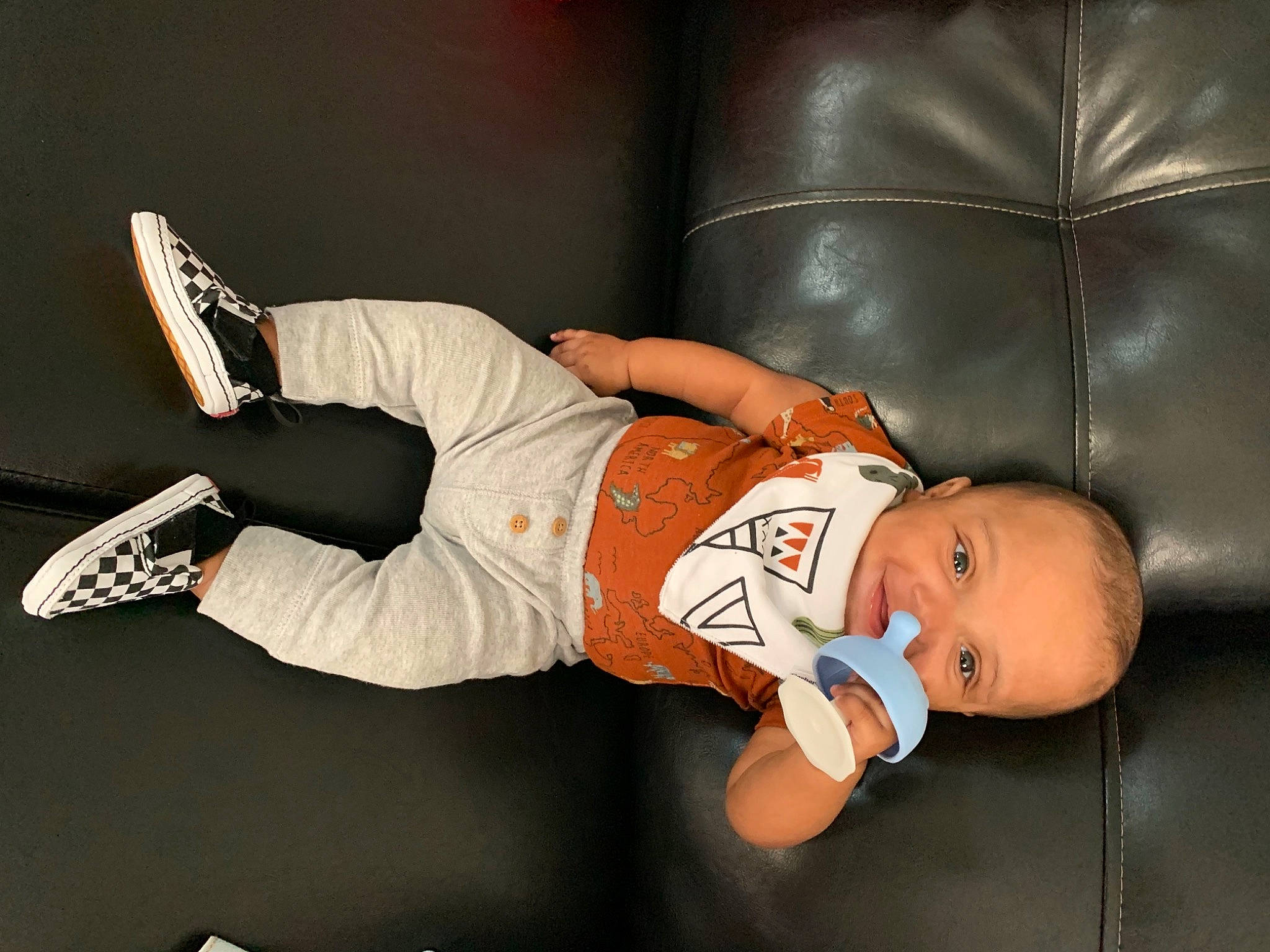 Kaylen is registered to the contest to win money with this photo: abdomen, baby, baby_products, baby_toddler_clothing, carmine, comfort, couch, elbow, flash_photography, fun, hat, human_leg, knee, person, room, sportswear, t_shirt, thigh, toddler, wood