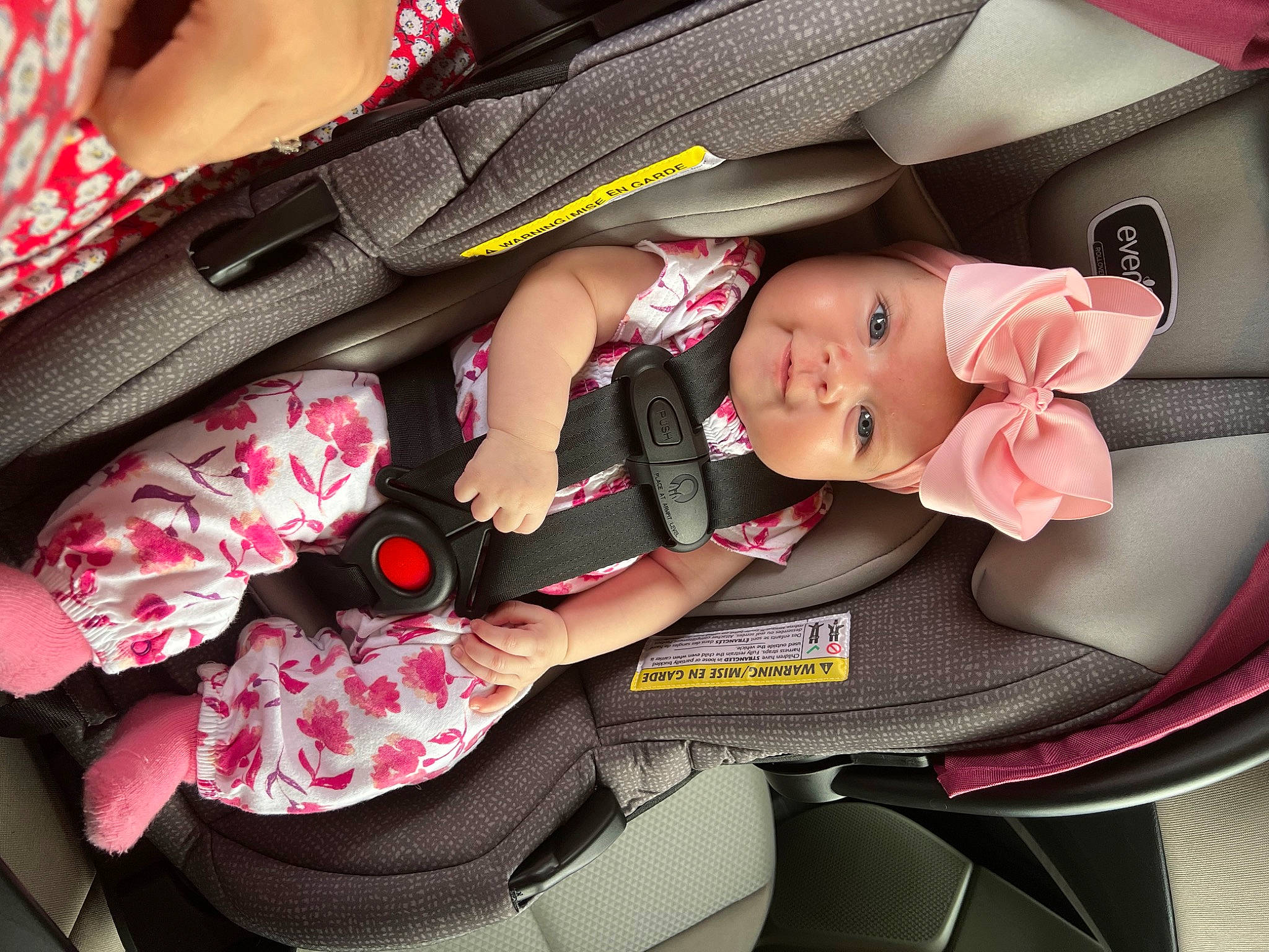 Rosilyn is registered to the contest to win money with this photo: auto_part, automotive_design, baby, baby_carriage, baby_in_car_seat, baby_products, bag, car_seat, car_seat_cover, child, comfort, family_car, headwear, person, pink, product, red, seat_belt, steering_wheel, toddler