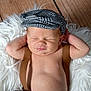 Noah participe au concours pour gagner de l'argent avec cette photo : baby, infant, sleeping, hat, suspenders, fluffy_rug, wooden_floor, relaxed, cute, portrait, child, fashion, newborn, resting, indoors, soft_texture, peaceful, clothing, headwear, smiling