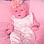 baby, infant, pink, headband, flower, cushion, leather, clothing, onesie, footwear, soft, indoor, portrait, cute, newborn, person, resting, comfort, child, babywear