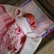 Rayne joined the competition — help win amazing prizes! baby, sleeping, blanket, pink, floral, towel, pacifier, playpen, infant, newborn, cozy, soft, wrapped, lying_down, indoors, child, peaceful, cute, resting, nursery