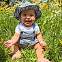 baby, child, smiling, hat, checkered, overalls, grass, flowers, sunlight, outdoor, nature, greenery, happy, sitting, cute, summer, toddler, field, playful, sunny