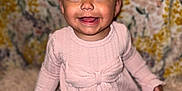 Evelyn is registered to the contest to win money with this photo: baby, bow, child, closeup, cute, face, floral_background, girl, happy, headband, indoors, infant, leggings, long_sleeves, patterned_leggings, pink_dress, portrait, rug, sitting, smiling