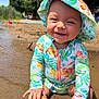 Evelyn joined the competition — help win amazing prizes! baby, beach, child, closeup, cute, floral_clothing, happy, nature, outdoor, playful, portrait, sand, sitting, smiling, summer, sun_hat, sunlight, toddler, vacation, water