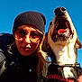 beanie, canine, casual, closeup, collar, daylight, dog, friendship, happy, jacket, nature, outdoor, pet, portrait, selfie, sky, smile, sunglasses, sunny, woman