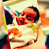 Jersey is registered to the contest to win money with this photo: baby, newborn, infant, blanket, cartoon_animals, hand, nasal_tube, medical_care, hospital, sleeping, closeup, person, portrait, cute, child, resting, soft_focus, colorful, toddler, warmth
