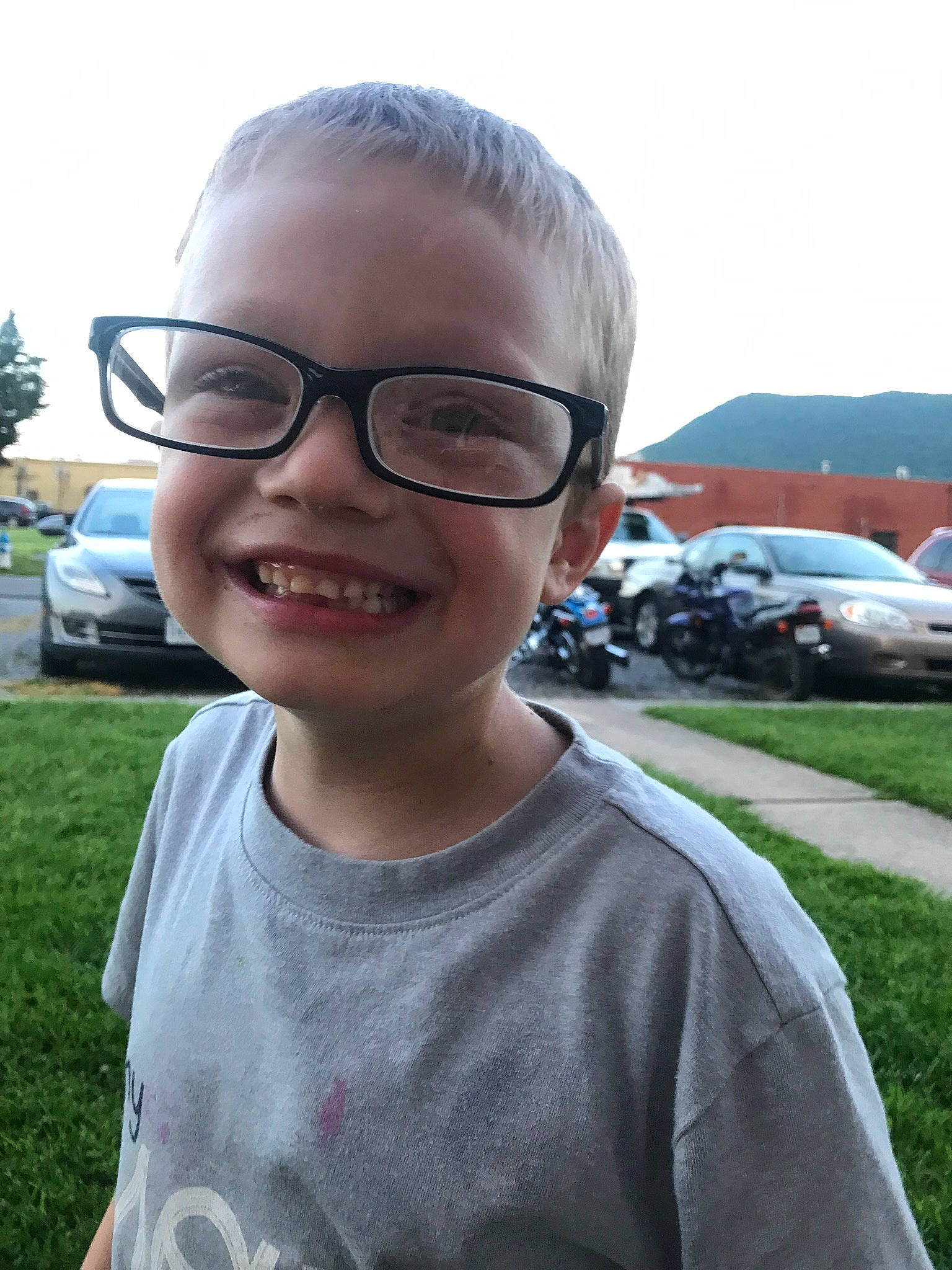 Carmine is registered to the contest to win money with this photo: child, chin, cool, eyewear, face, facial_expression, forehead, glasses, grass, hair, hairstyle, head, joy, person, photography, smile, sunglasses, vacation, vision_care