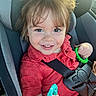toddler, child, car_seat, smile, red_shirt, toy, seatbelt, happy, portrait, indoors, cute, baby, young_child, seat, safety, hands, playful, casual_clothing, closeup, bright