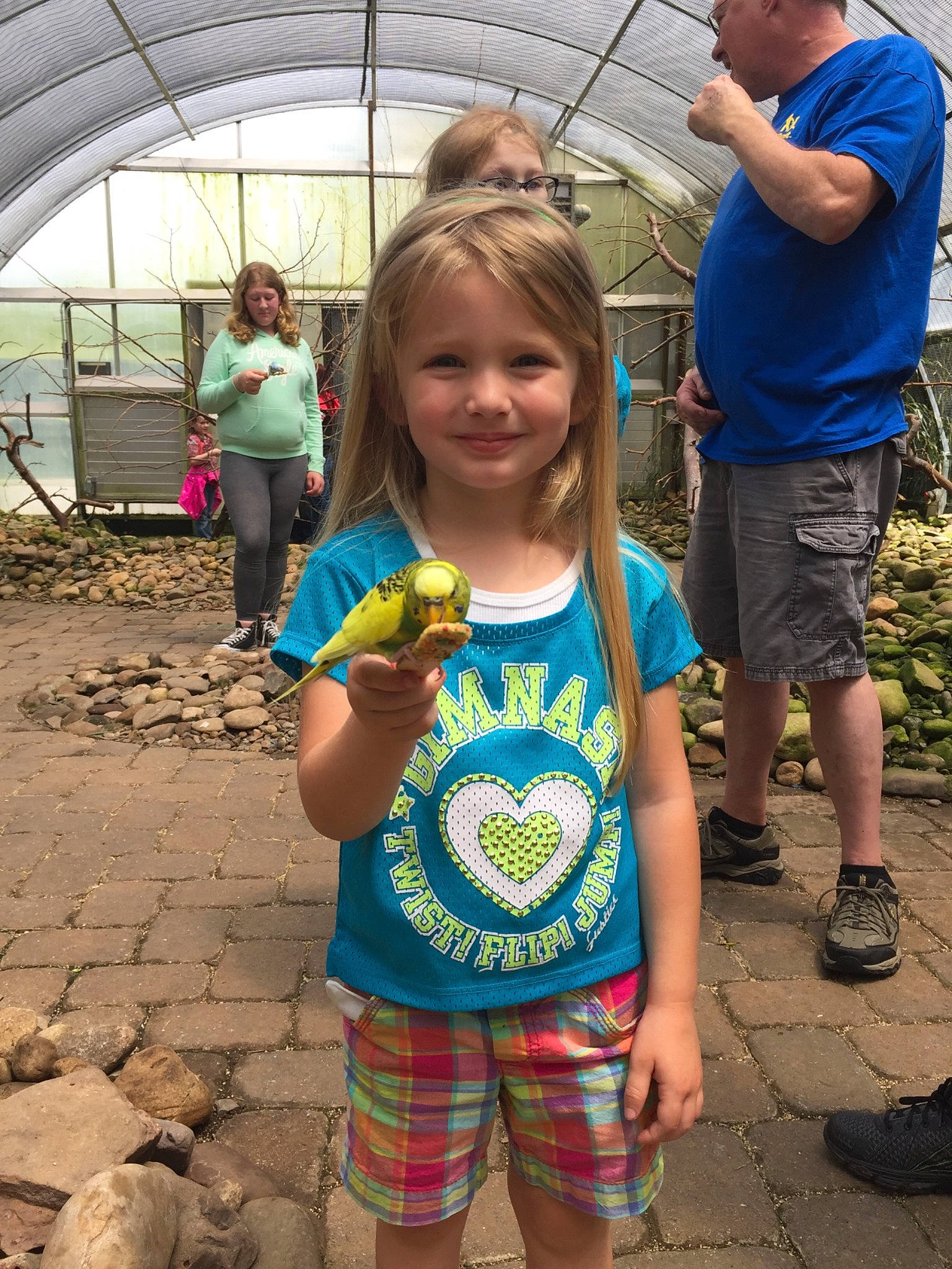 Taryn is registered to the contest to win money with this photo: child, day, fun, girl, joy, pattern, person, plaid, product, public_space, recreation, smile, summer, toddler, tree, vacation, vertebrate, world