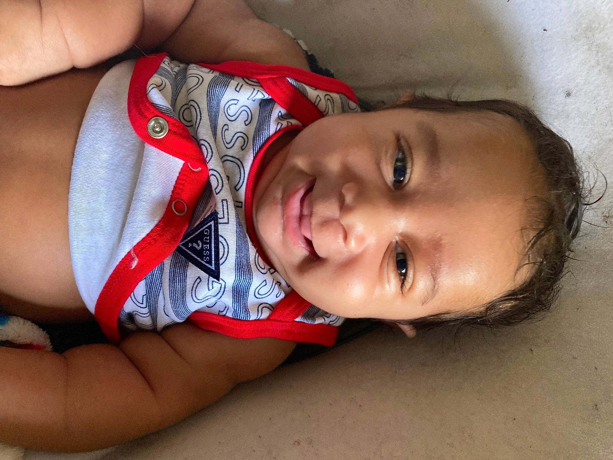 Arie is registered to the contest to win money with this photo: abdomen, black_hair, cheek, chest, child, elbow, eye, face, fun, happy, human_leg, lip, mouth, neck, nose, person, skin, smile, thigh, toddler