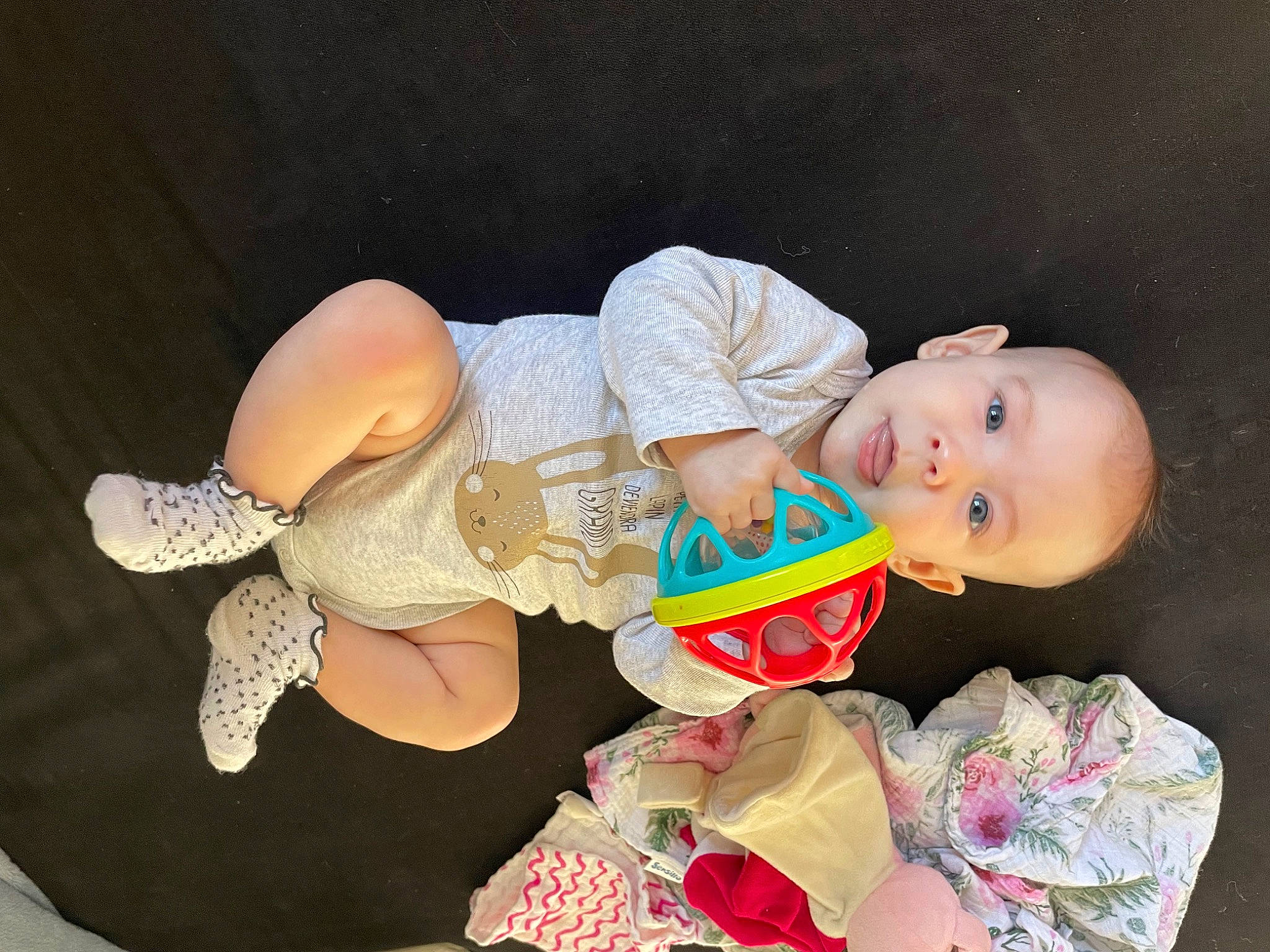 Arya participe au concours pour gagner de l'argent avec cette photo : baby, baby_products, baby_toddler_clothing, baby_toys, child, costume, doll, fashion_accessory, finger, happy, hat, headgear, lap, nail, peach, person, pink, sitting, smile, toddler