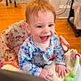 Elowyn is registered to the contest to win money with this photo: baby, baby_walker, background, carpet, child, couch, cute, dog, floral_clothing, furniture, happy, home, indoor, living_room, person, red_hair, smiling, table, toys, wooden_floor