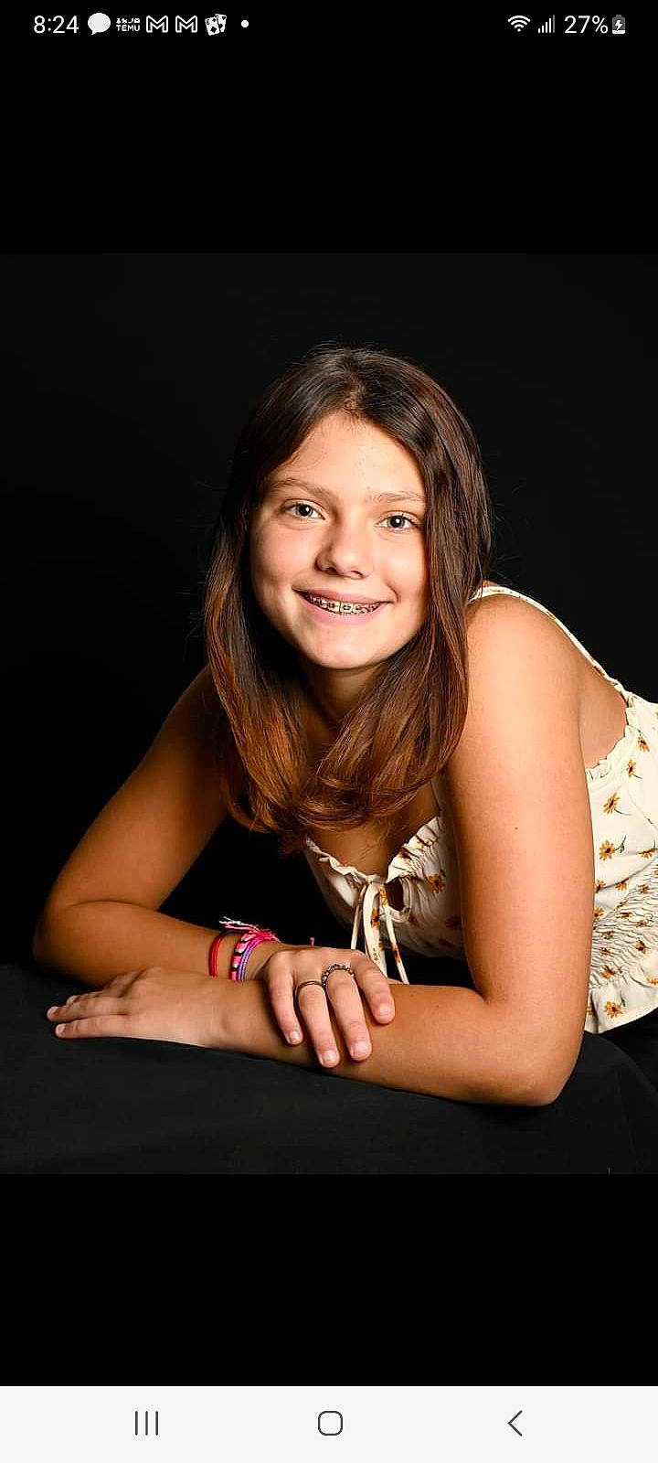 Alexandra is registered to the contest to win money with this photo: black_hair, blond, brown_hair, elbow, eyebrow, eyelash, flash_photography, fun, gesture, hand, happy, human_leg, jewellery, joy, lip, long_hair, nail, person, sitting, skin