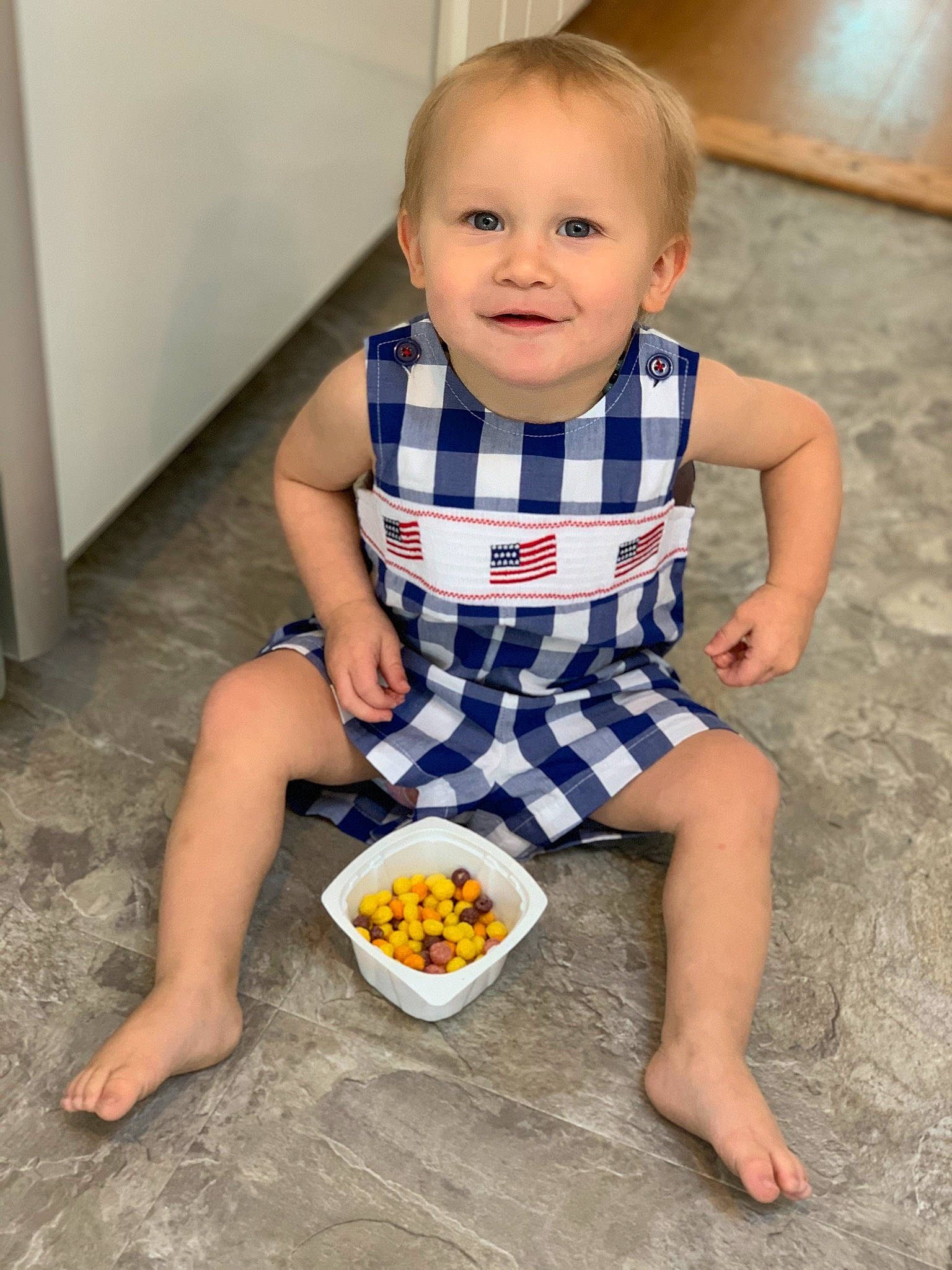 Liam joined the competition — help win amazing prizes! baby, baby_toddler_clothing, barefoot, child, dress, face, finger, flooring, food, fun, grape, happy, human_leg, joy, pattern, person, sitting, sleeve, smile, standing
