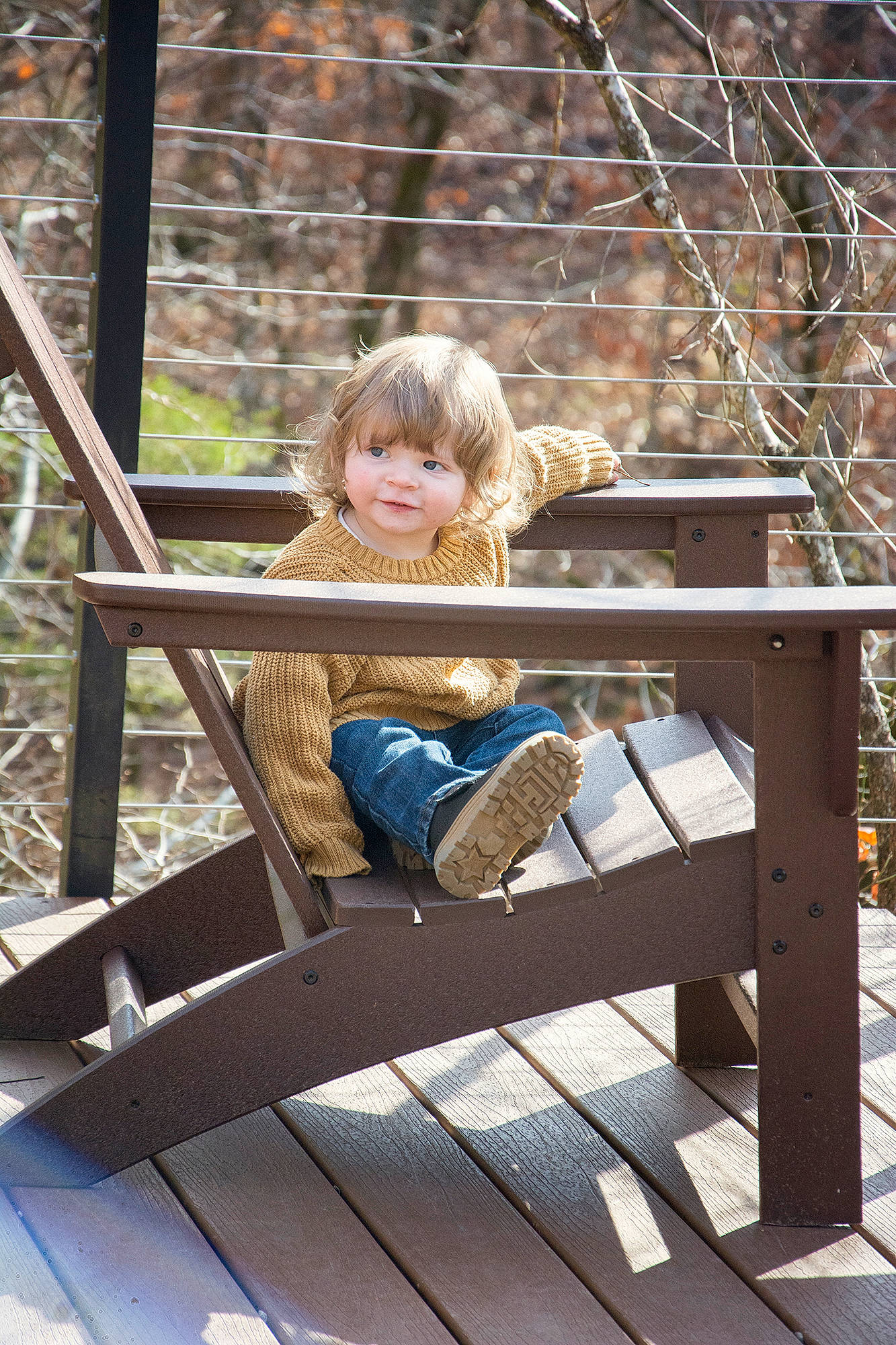Clarence is registered to the contest to win money with this photo: blond, chair, child, denim, fun, grass, happy, jeans, leisure, outdoor_furniture, people_in_nature, person, plant, recreation, sitting, smile, t_shirt, toddler, tree, wood