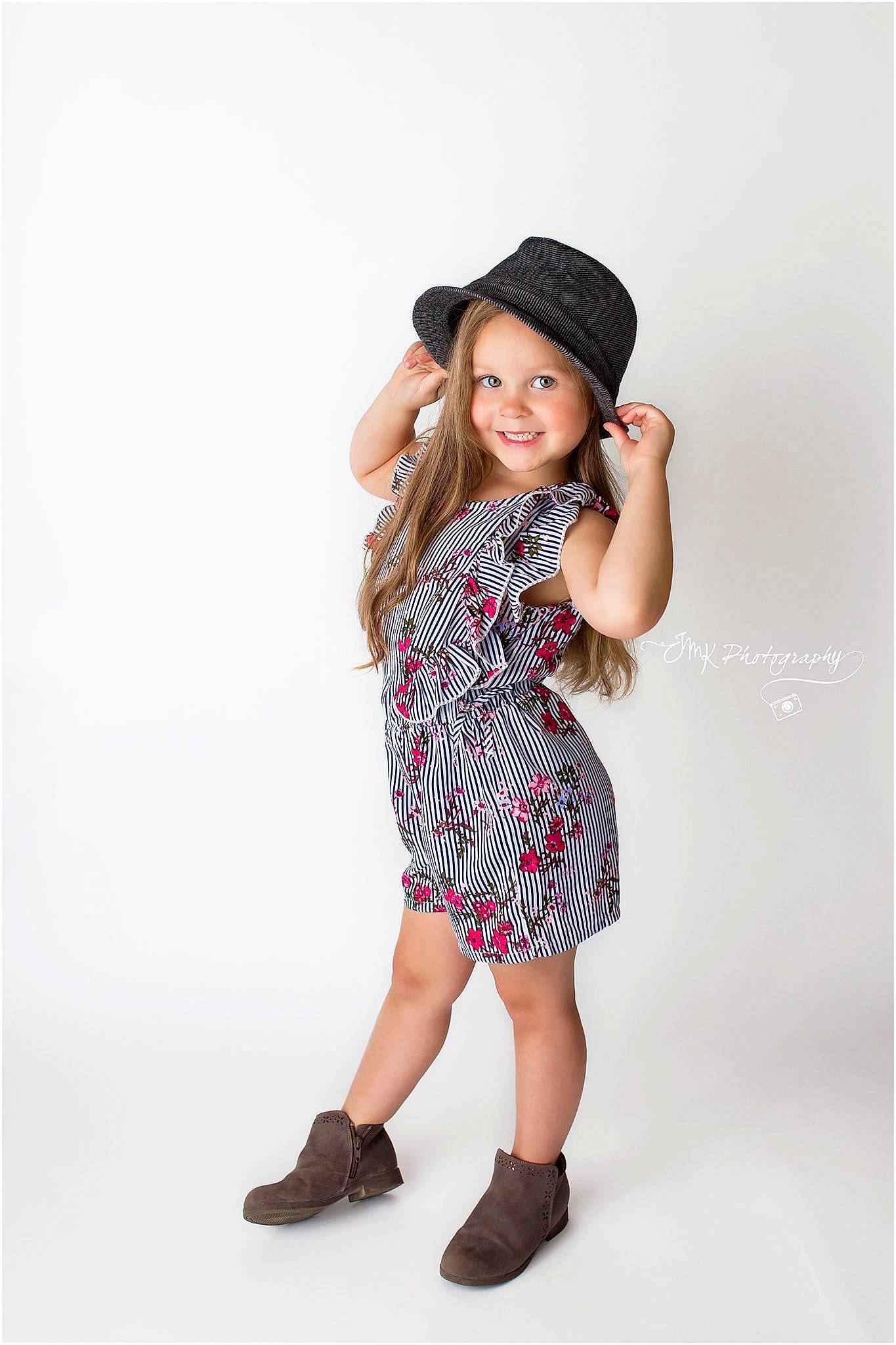 Karsen is registered to the contest to win money with this photo: beanie, cap, child, child_model, clothing, design, dress, footwear, hat, headgear, joy, pattern, person, photo_shoot, photography, shoe, sleeve, sun_hat, t_shirt, toddler