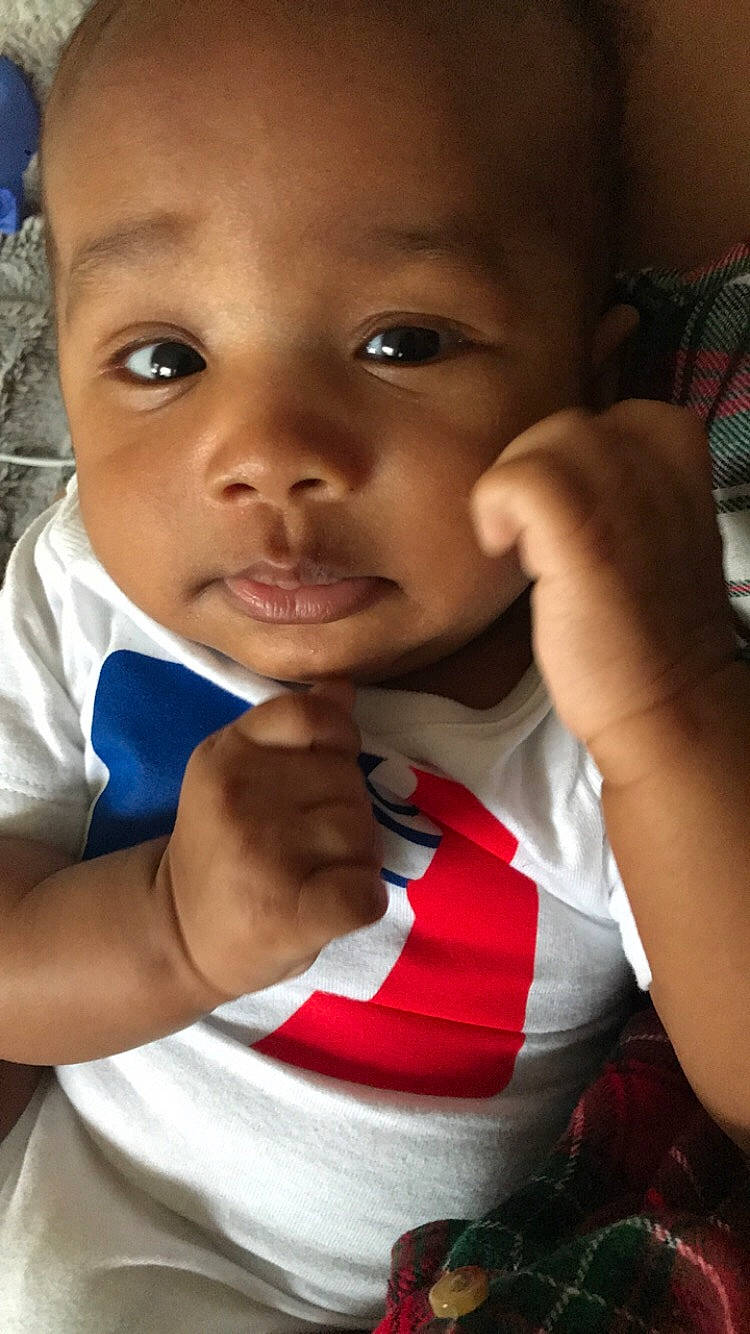 Camron is registered to the contest to win money with this photo: baby, cheek, child, face, facial_expression, gesture, lip, mouth, nose, person, skin, smile, toddler