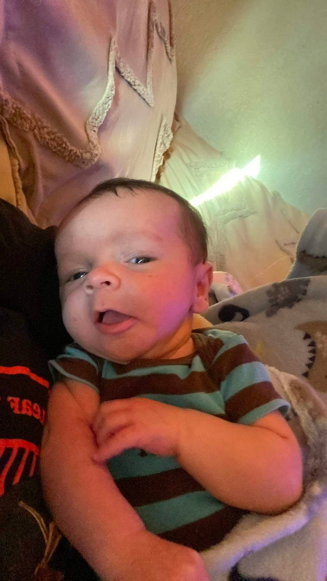 Christian is registered to the contest to win money with this photo: baby, baby_toddler_clothing, cheek, child, chin, comfort, cool, eye, finger, fun, happy, iris, mouth, nose, person, room, sitting, skin, smile, thumb