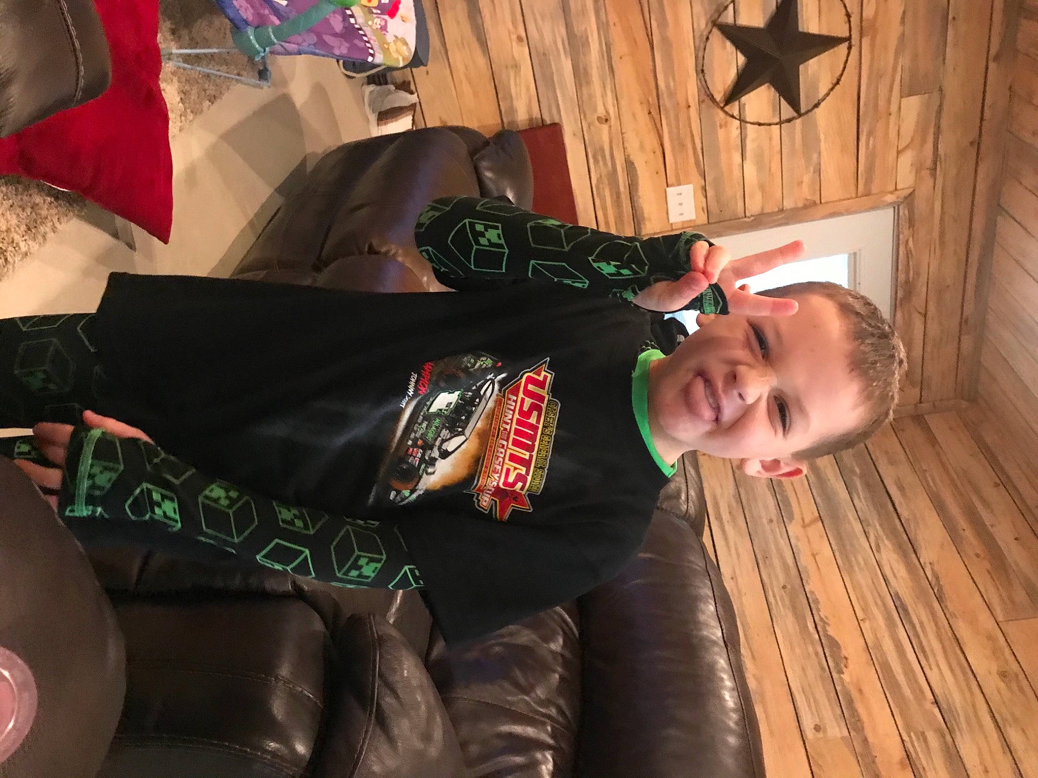 Kolt is registered to the contest to win money with this photo: baby, child, comfort, cool, fashion, fashion_accessory, flash_photography, flooring, fun, happy, hardwood, joy, person, personal_protective_equipment, room, sitting, sleeve, smile, suit, textile