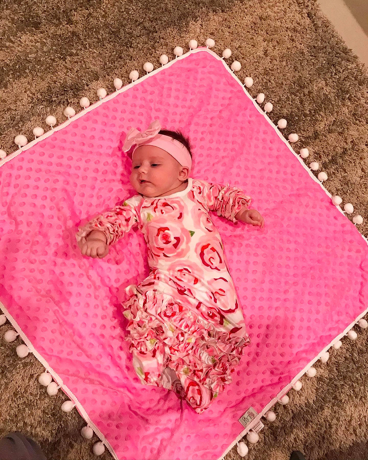 Mila joined the competition — help win amazing prizes! baby, baby_toddler_clothing, child, clothing, dress, flooring, grass, headgear, headwear, linens, magenta, outerwear, pattern, person, pink, product, purple, rectangle, sleeve, textile