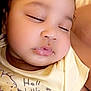 Imani joined the competition — help win amazing prizes! baby, sleeping, close_up, curly_hair, yellow_shirt, cartoon_print, soft_lighting, peaceful, child, portrait, skin, face, cute, infant, toddler, resting, indoors, clothing, smile, head