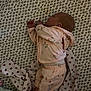 Winsley joined the competition — help win amazing prizes! baby, sleeping, pajamas, blanket, patterned, infant, cozy, bedtime, soft_lighting, child, resting, foot, hand, face, cute, indoors, textile, floral, pink, peaceful