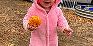 Xalia joined the competition — help win amazing prizes! toddler, child, pumpkin, pink_costume, outdoor, dirt, fall, autumn, house, car, smile, cute, playful, hood, footwear, leaf, ground, vehicle, gate, daytime