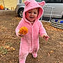 toddler, child, pumpkin, pink_costume, outdoor, dirt, fall, autumn, house, car, smile, cute, playful, hood, footwear, leaf, ground, vehicle, gate, daytime