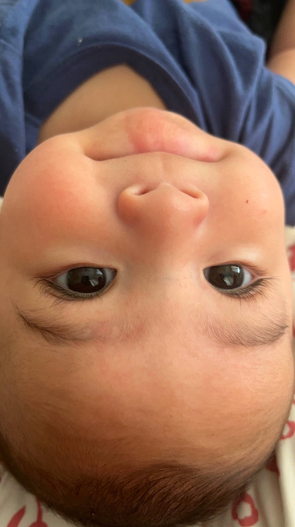 Adan is registered to the contest to win money with this photo: baby, cheek, chin, ear, eye, eyebrow, eyelash, facial_expression, forehead, gesture, human_body, iris, jaw, lip, mammal, mouth, nail, neck, nose, person
