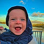 Antoine a rejoint le concours — aidez-le/la à gagner de superbes lots ! baby, blue_eyes, child, clouds, cute, daylight, expression, face, happy, hoodie, infant, lake, nature, outdoor, person, portrait, sky, smiling, warm_clothing, water