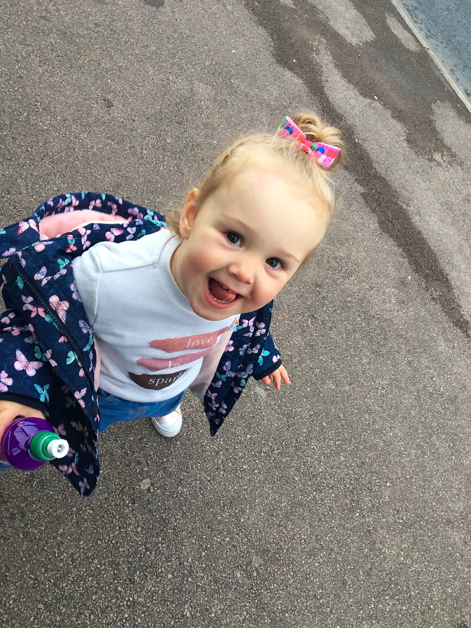 Jorja is registered to the contest to win money with this photo: baby, child, cool, face, fun, hair, hairstyle, head, joy, pattern, people, person, photography, pink, plant, play, skin, smile, toddler, vacation