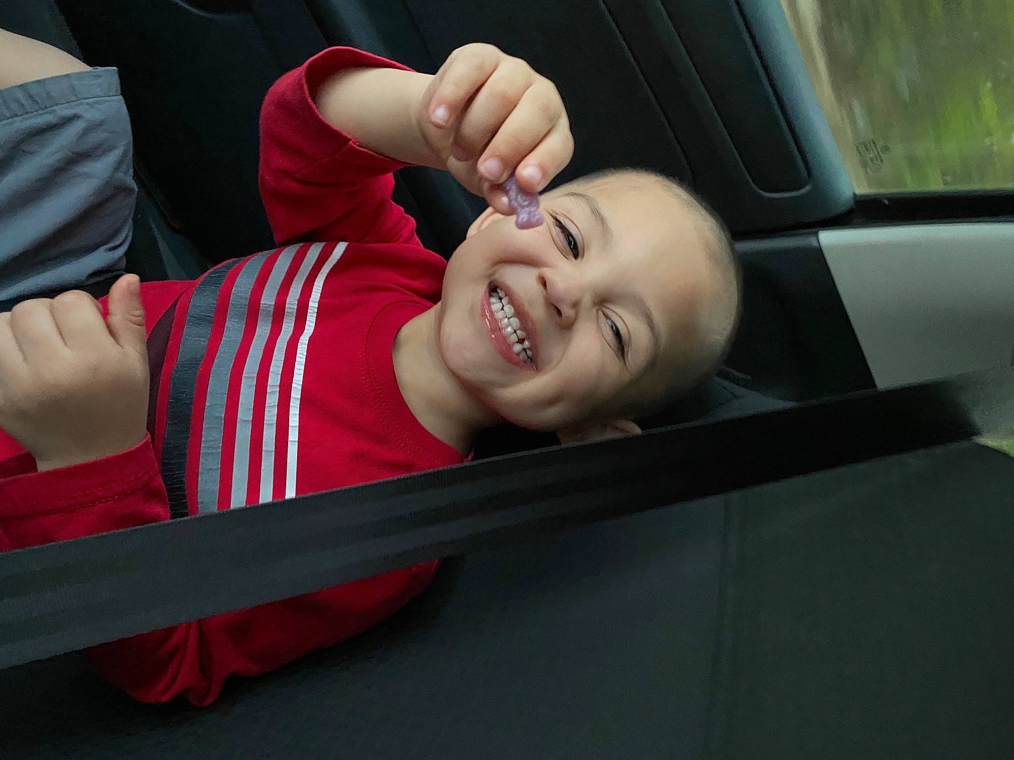 Adrian is registered to the contest to win money with this photo: auto_part, automotive_exterior, baby, baby_toddler_clothing, bumper, car_seat, child, comfort, finger, fun, gesture, hand, happy, joy, leisure, person, sleeve, smile, thumb, toddler