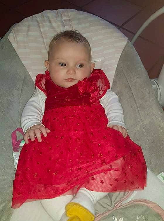 Elyna participe au concours pour gagner de l'argent avec cette photo : baby, baby_toddler_clothing, cheek, child, comfort, day_dress, dress, human_body, iris, linens, lip, magenta, one_piece_garment, pattern, person, pink, skin, sleeve, smile, textile