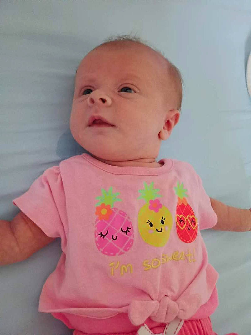 Kayla joined the competition — help win amazing prizes! baby, baby_products, baby_toddler_clothing, cheek, child, facial_expression, happy, magenta, pattern, peach, person, pink, product, skin, sleeve, smile, t_shirt, toddler