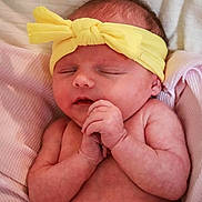 Reagan joined the competition — help win amazing prizes! newborn, baby, sleeping, headband, yellow, hands, clasped, blanket, pink, white, skin, face, peaceful, infant, closeup, cuddly, soft, resting, portrait, indoors