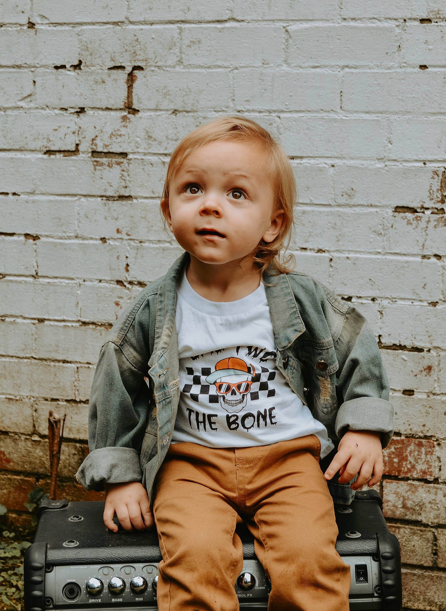 Raylan joined the competition — help win amazing prizes! bag, blond, brick, brickwork, child, denim, grass, hairstyle, happy, jacket, jeans, jewellery, outerwear, person, photograph, sitting, sleeve, soil, t_shirt, toddler