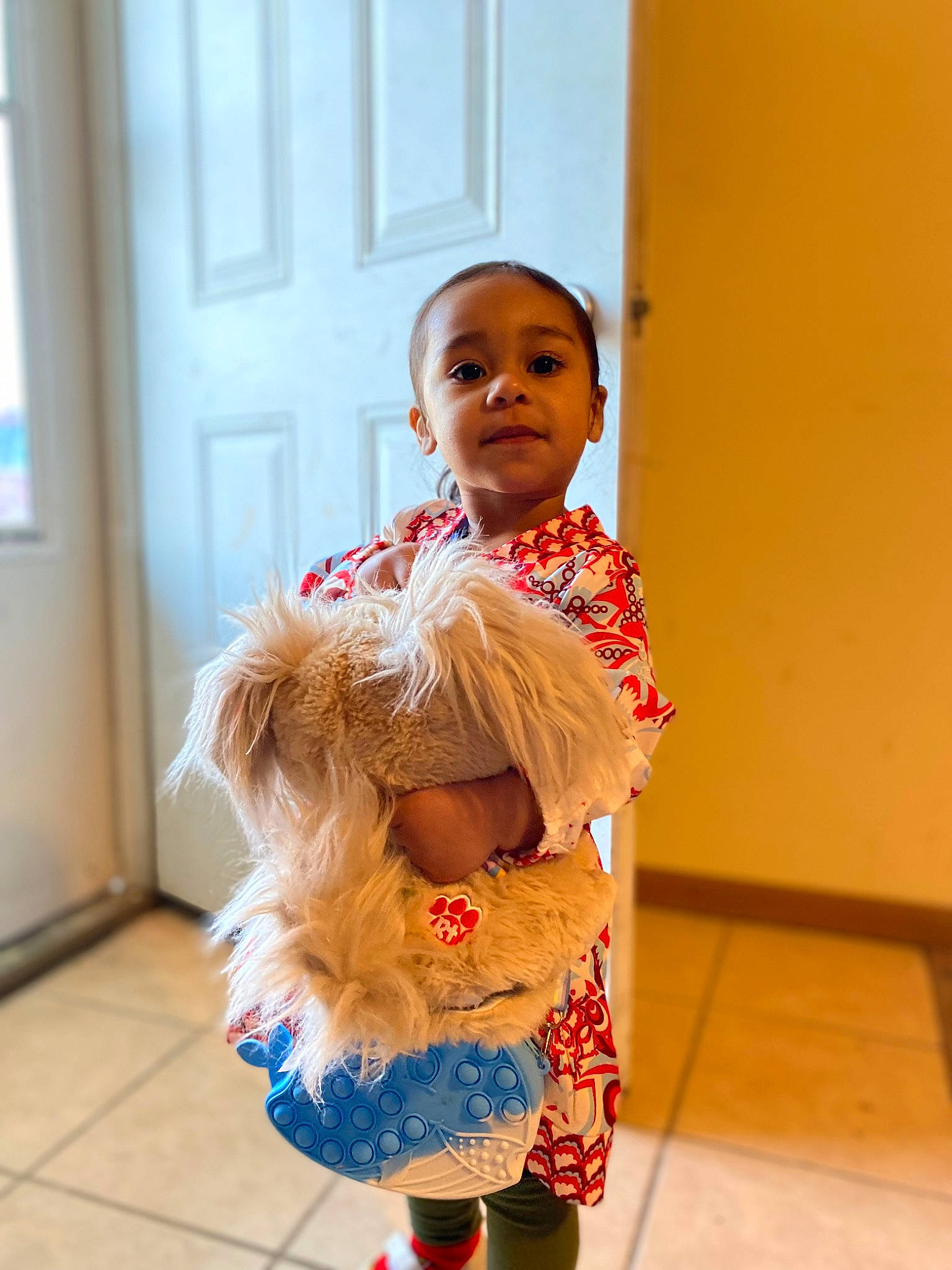 Jayline is registered to the contest to win money with this photo: arm, baby, baby_toddler_clothing, child, door, dress, event, fashion_design, floor, flooring, fun, happy, human_leg, nose, pattern, person, skin, sleeve, toddler, toy