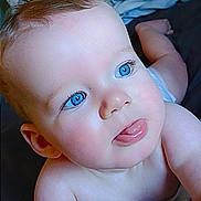 Colton joined the competition — help win amazing prizes! baby, blue_eyes, tongue_out, close_up, infant, cute, skin, face, head, arm, bed, blanket, soft, child, person, newborn, expression, playful, indoors, portrait