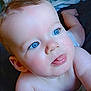 baby, blue_eyes, tongue_out, close_up, infant, cute, skin, face, head, arm, bed, blanket, soft, child, person, newborn, expression, playful, indoors, portrait