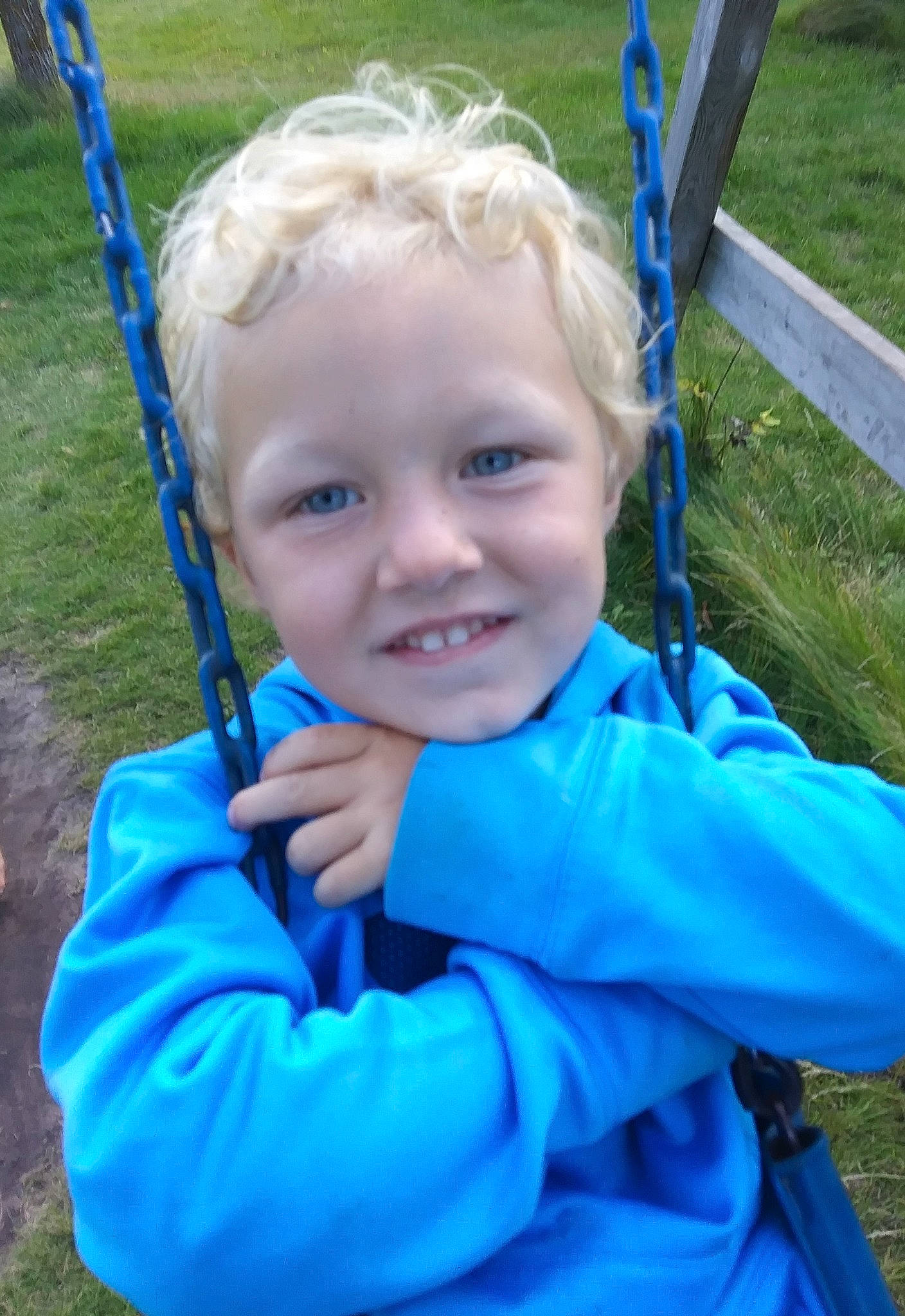 Owen joined the competition — help win amazing prizes! child, electric_blue, face, fun, grass, human_settlement, joy, outdoor_play_equipment, person, play, playground, public_space, smile, swing, toddler, vacation