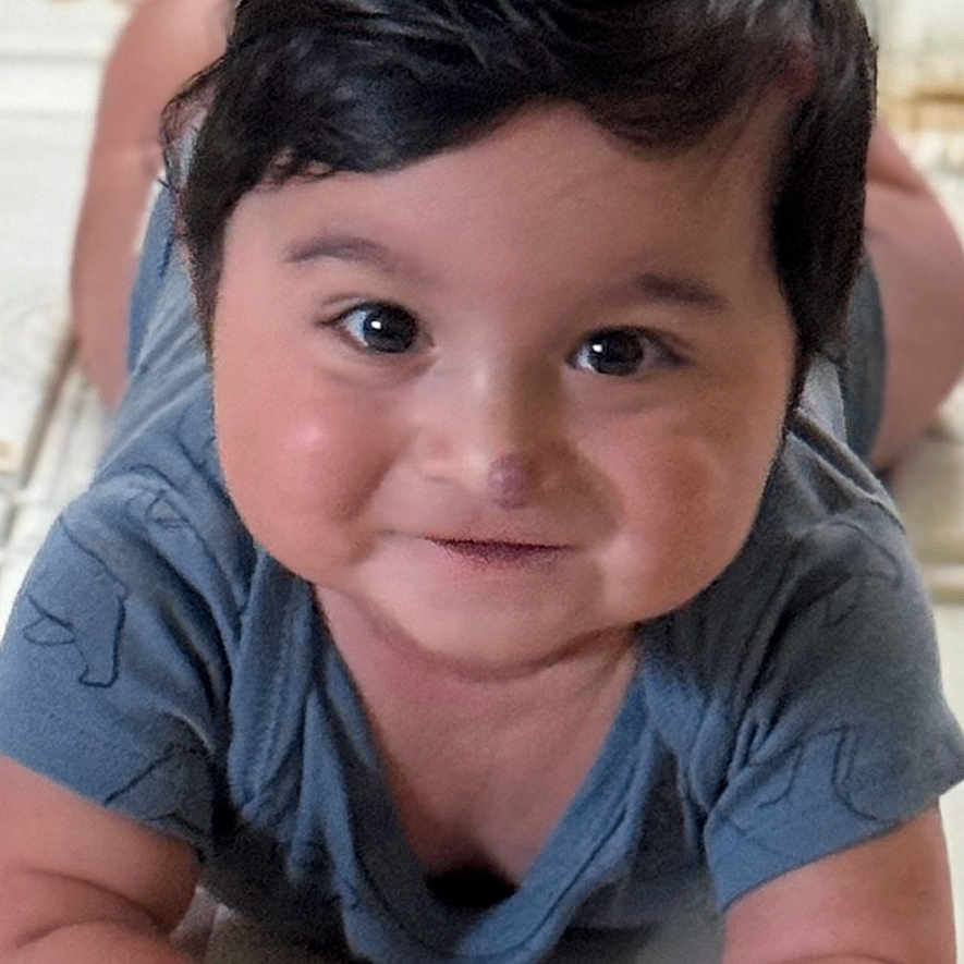 Mahir joined the competition — help win amazing prizes! baby, child, tummy, smile, cute, indoor, patterned_mat, hands, black_hair, skin, infant, young_child, portrait, happy, lying_down, closeup, person, adorable, chubby_cheeks, crawling_position