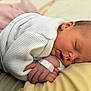 newborn, baby, sleeping, infant, cozy, white_sweater, knitted, soft, peaceful, closeup, skin, hand, face, rest, cute, portrait, child, bed, blanket, warm