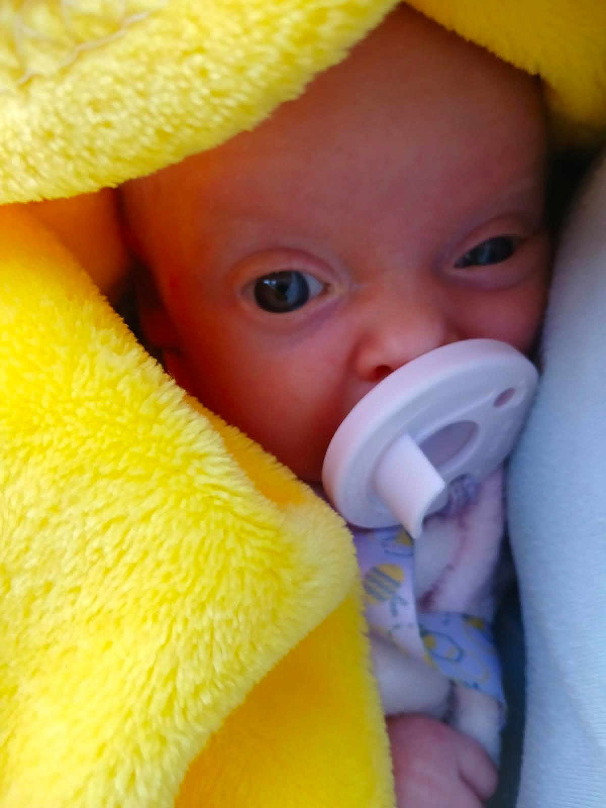 Brilynn joined the competition — help win amazing prizes! baby, pacifier, blanket, yellow, face, infant, closeup, soft, cute, newborn, wrapped, sleepwear, hand, skin, child, portrait, cozy, warm, expression, resting