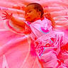 Miauna is registered to the contest to win money with this photo: baby, infant, pink_blanket, watermelon_pattern, clothing, lying_down, cute, small_hands, soft_texture, relaxed_pose, curious_look, indoors, child, newborn, sleepwear, infant_garment, baby_boy, colorful, portrait, resting