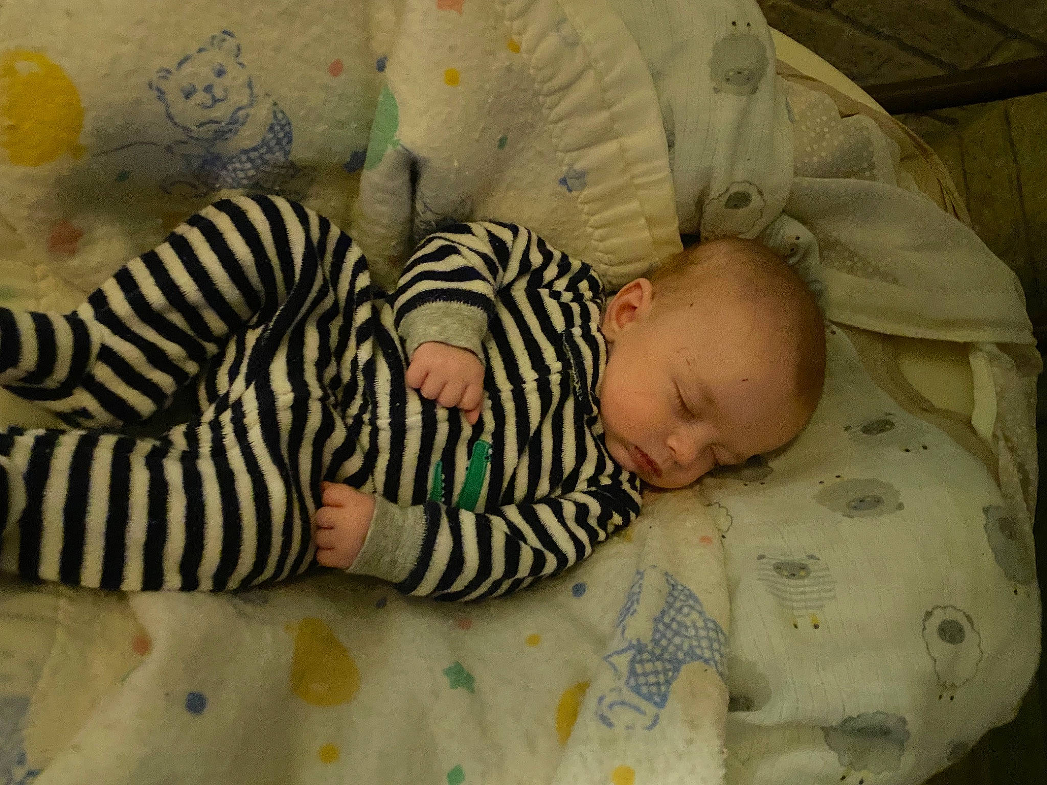 Micheal is registered to the contest to win money with this photo: baby, baby_products, baby_sleeping, baby_toddler_clothing, bedding, bedtime, cheek, child, comfort, facial_expression, flooring, head, linens, mouth, nap, pattern, person, room, skin, textile