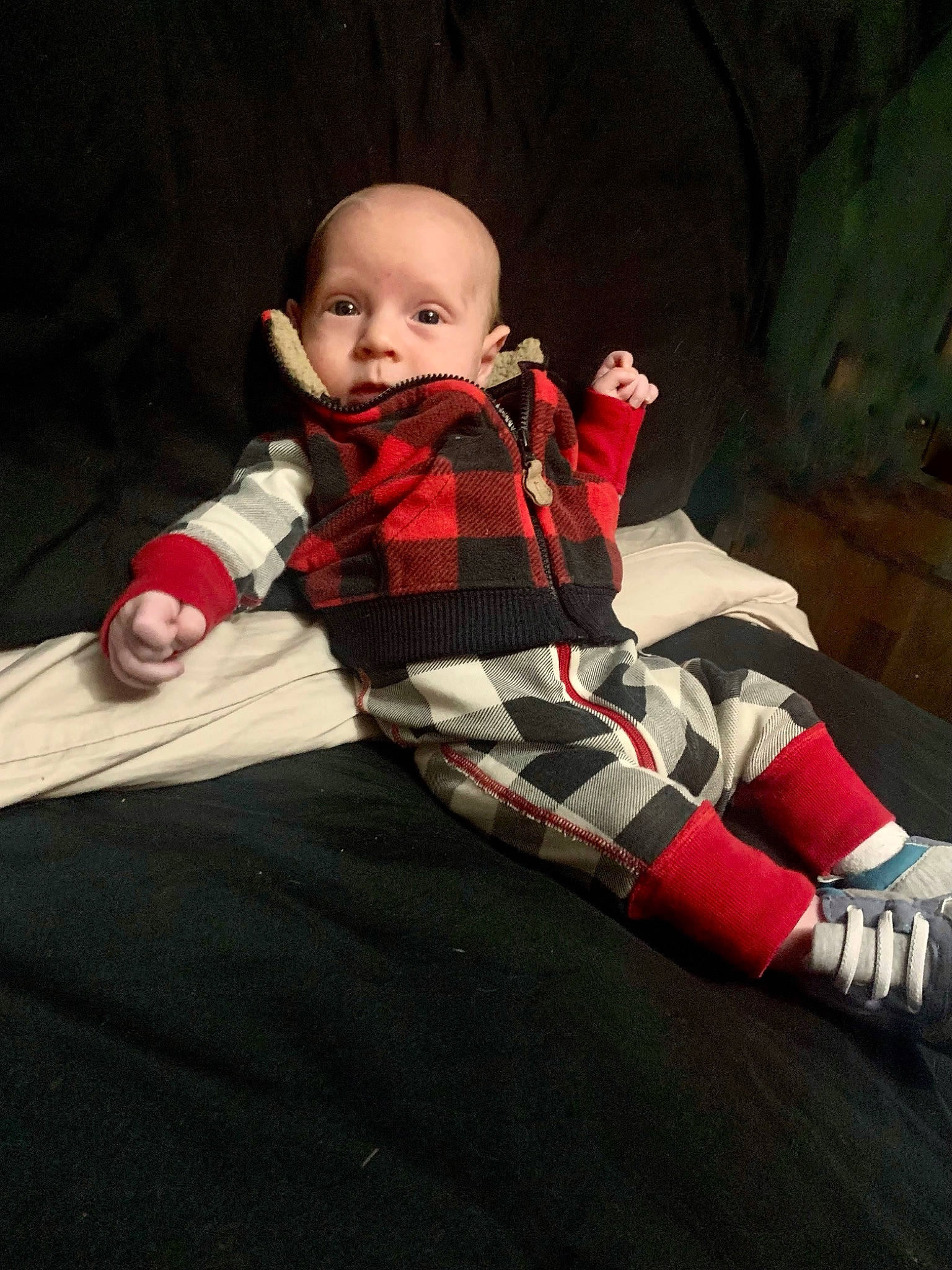 Cashton is registered to the contest to win money with this photo: baby, baby_toddler_clothing, carmine, comfort, doll, fashion_design, flash_photography, flooring, human_body, leg, pattern, person, plaid, sitting, sleeve, sock, tartan, toddler, toy, tree