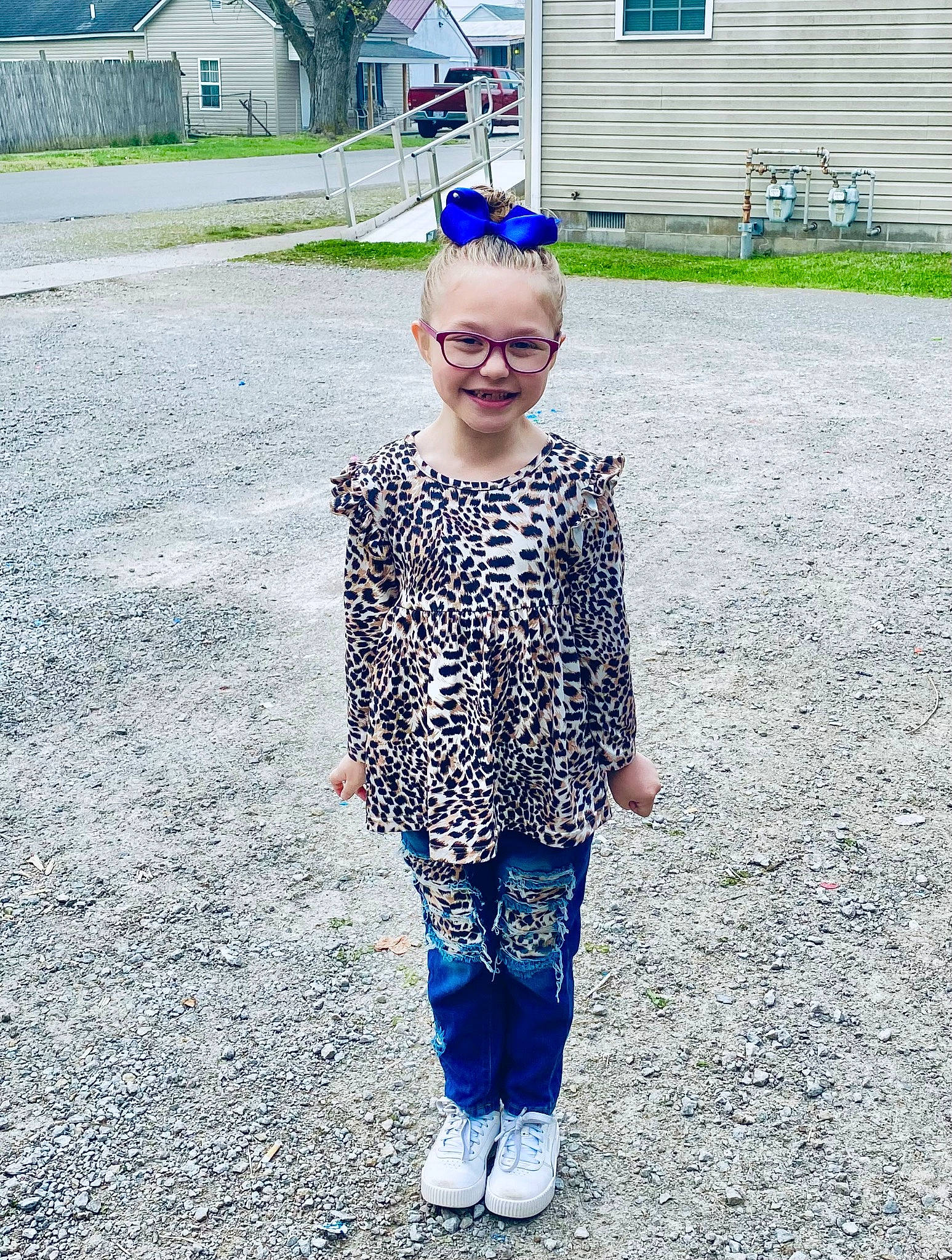 Carly joined the competition — help win amazing prizes! asphalt, building, child, denim, electric_blue, eyewear, fun, grass, happy, joy, outerwear, pattern, people_in_nature, person, plant, recreation, road_surface, smile, toddler, tree