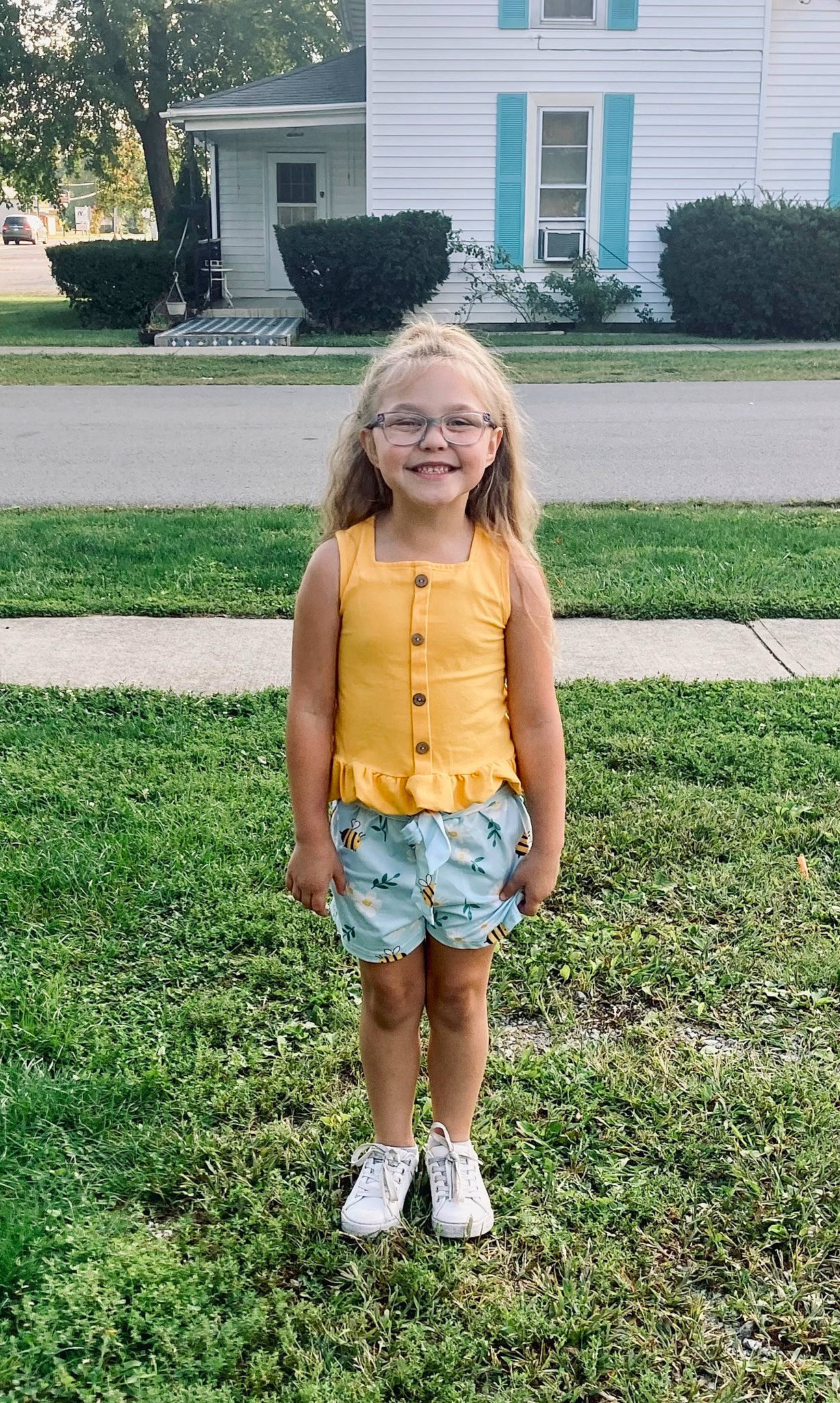 Carly is registered to the contest to win money with this photo: denim, door, grass, hair, happy, house, jean_short, joy, lawn, leg, leisure, long_hair, people_in_nature, person, plant, shorts, sleeve, smile, t_shirt, tree