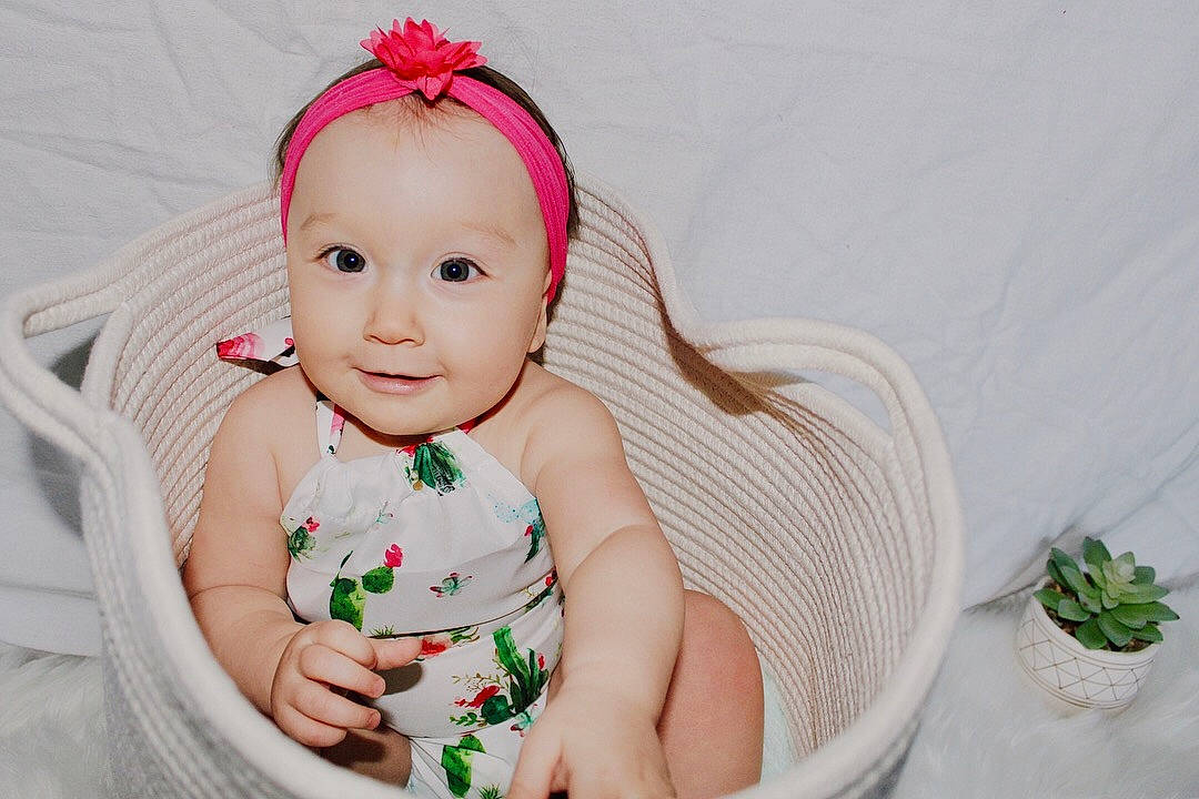 Maliya joined the competition — help win amazing prizes! baby, cheek, child, dress, face, fashion_accessory, hair_accessory, hand, head, headband, headgear, headpiece, lip, person, photography, pink, plant, product, skin, smile